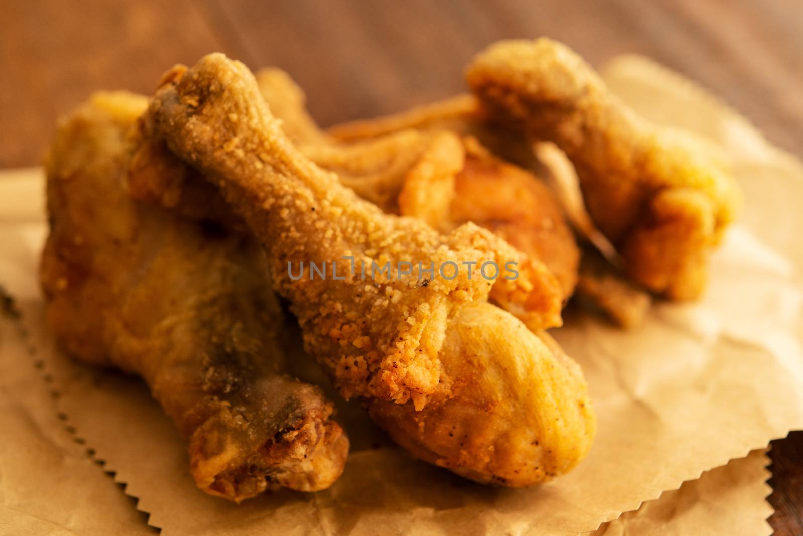 Close up original recipe fried chickens, on dark wooden background.