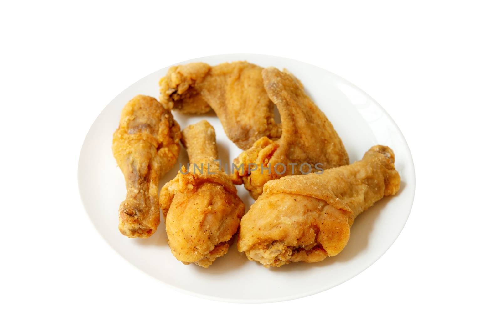 Plated of full original recipe fried chicken, isolated on white background.