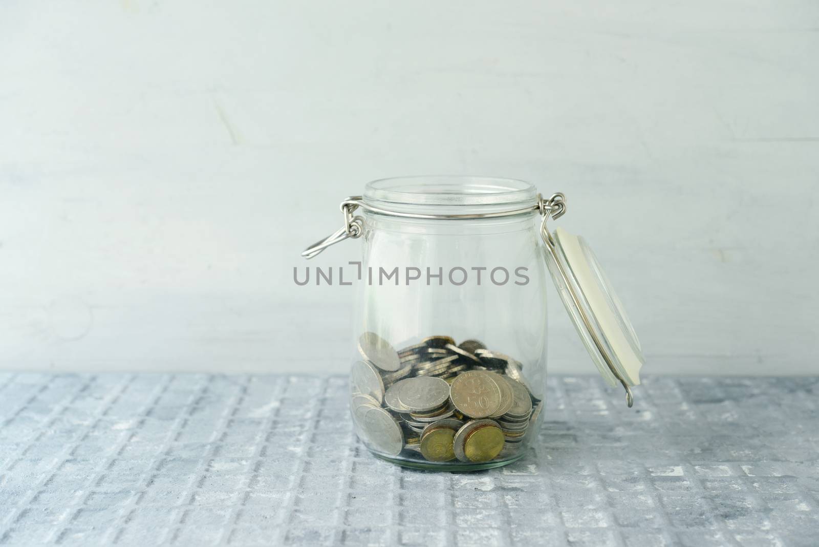 Saving jar with coins by szefei