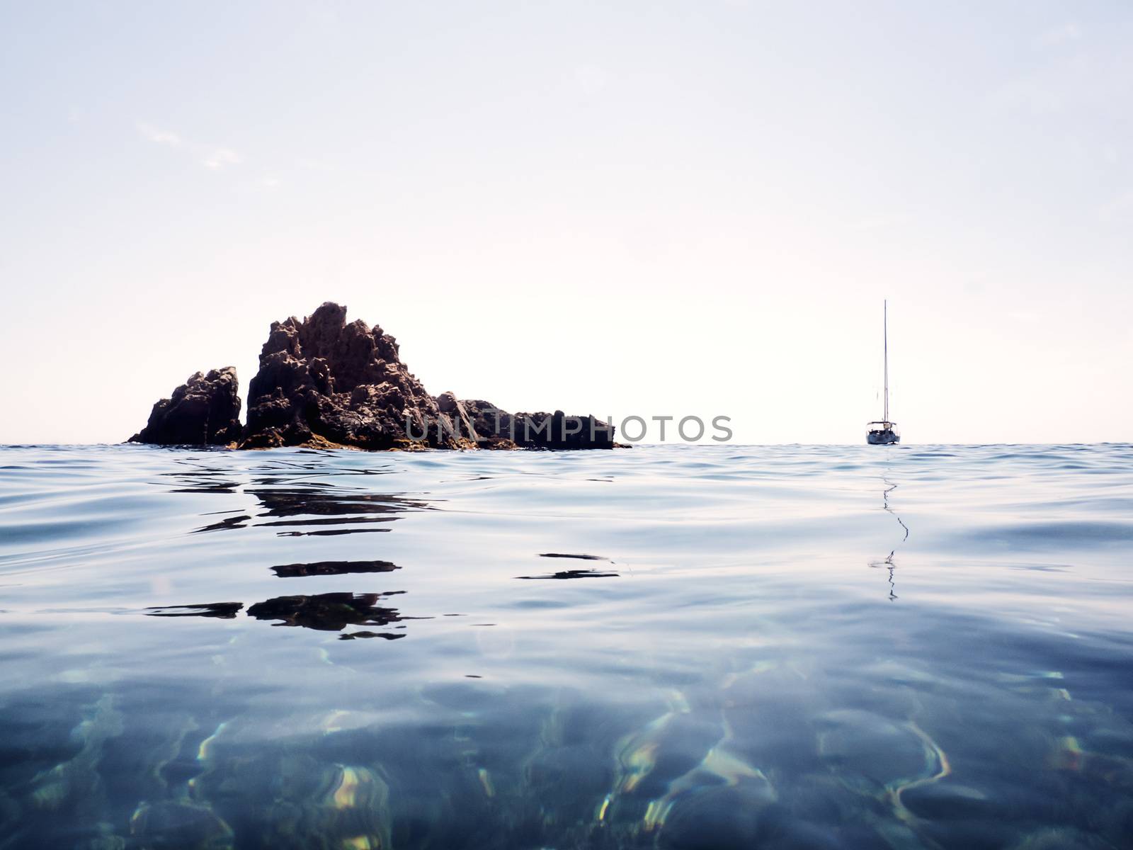 Mediterranean seascape with rocks and a boat by raulmelldo