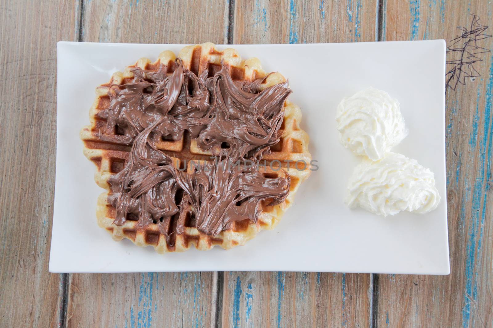 Nutella waffle with whipped cream by haiderazim