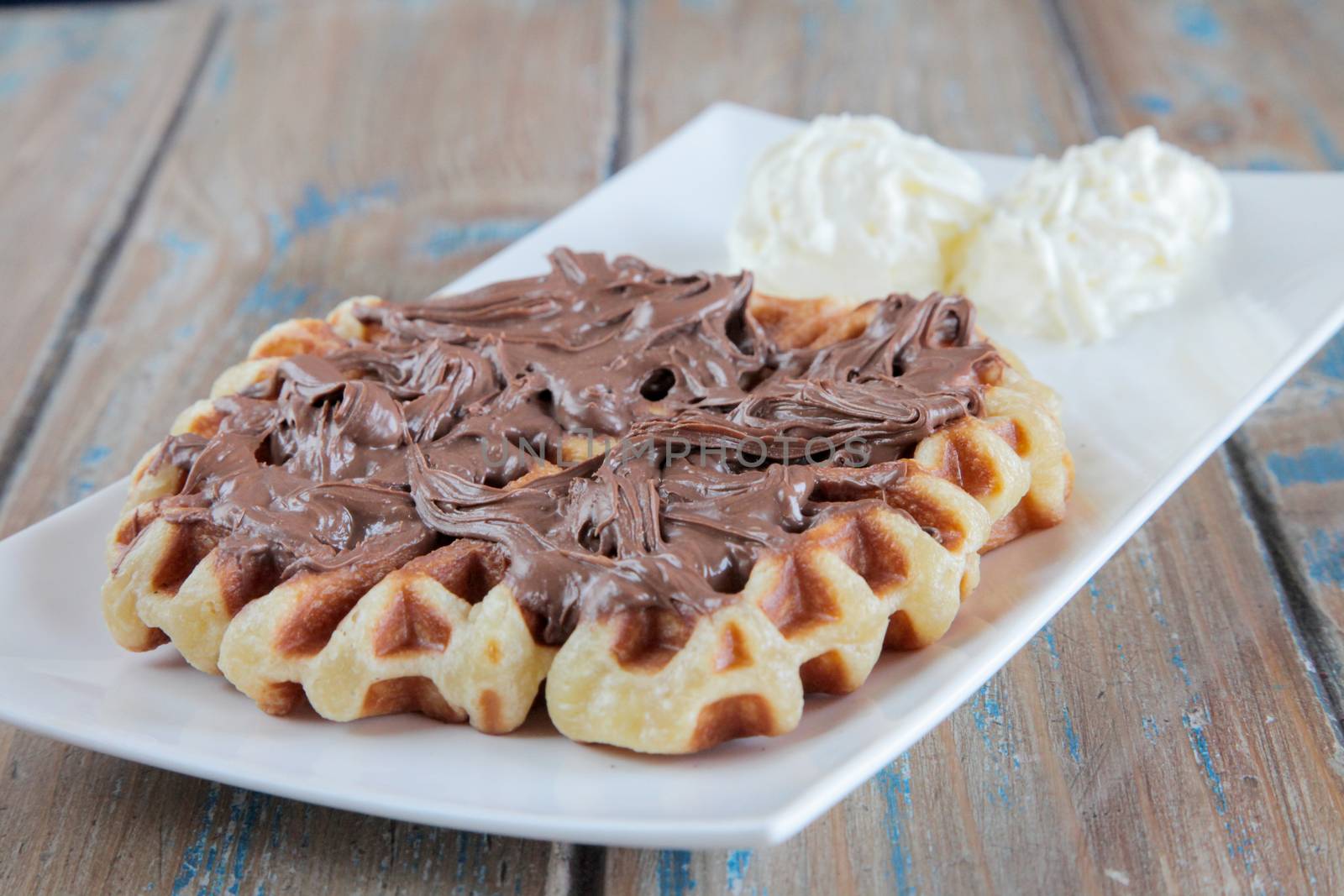 Nutella waffle with whipped cream by haiderazim