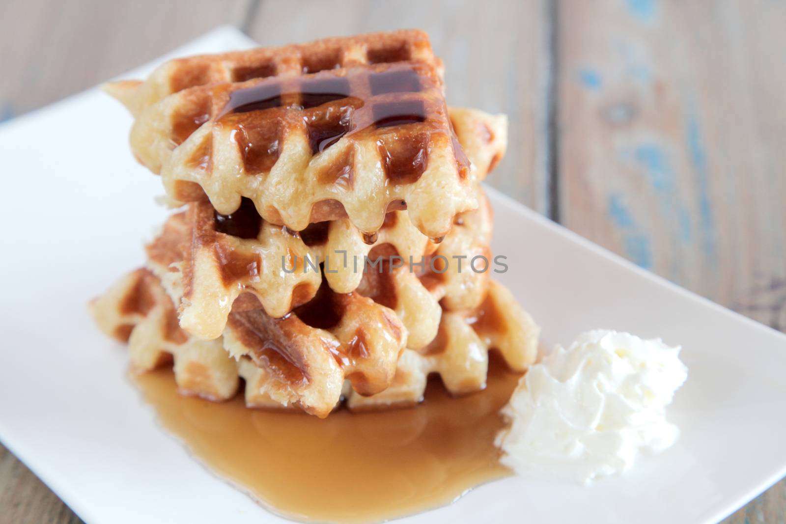 Maple syrup waffle with whipped vanilla ice cream
