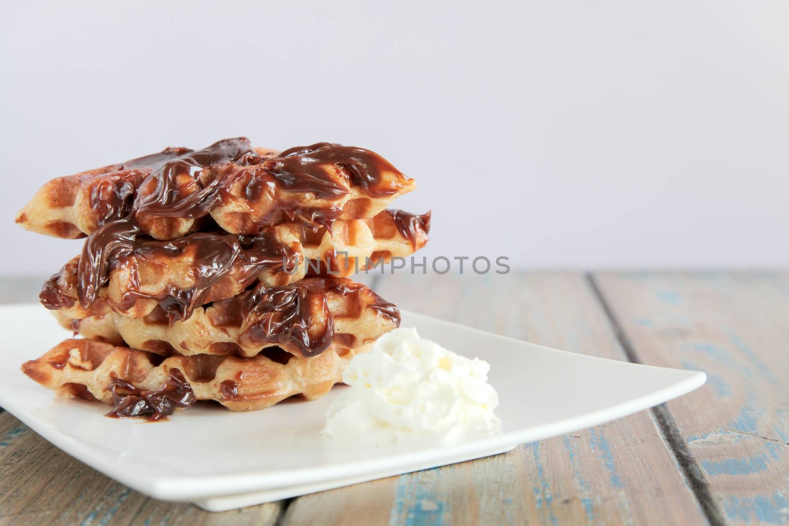 Chocolate fudge waffle with whipped cream by haiderazim