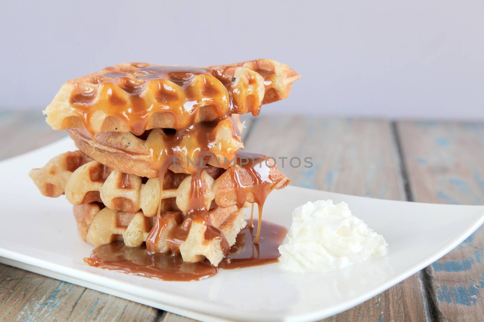 Caramel waffle with whipped cream by haiderazim