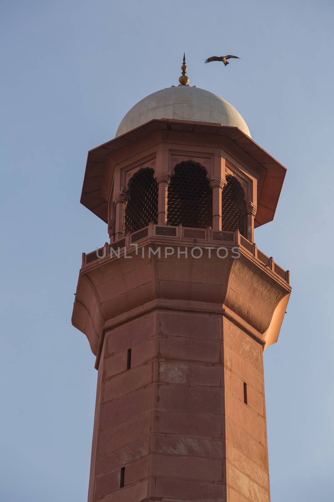 Minaret Tower of calling prayer to muslims close up by haiderazim