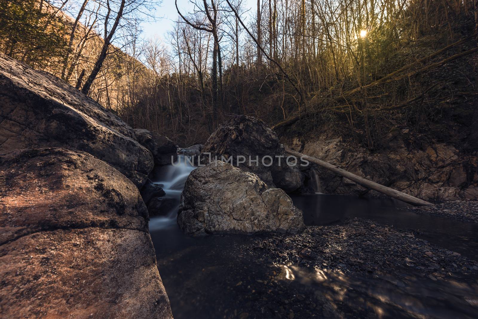 long exposure of a river with large stones in autumn. Effect of water in movement
