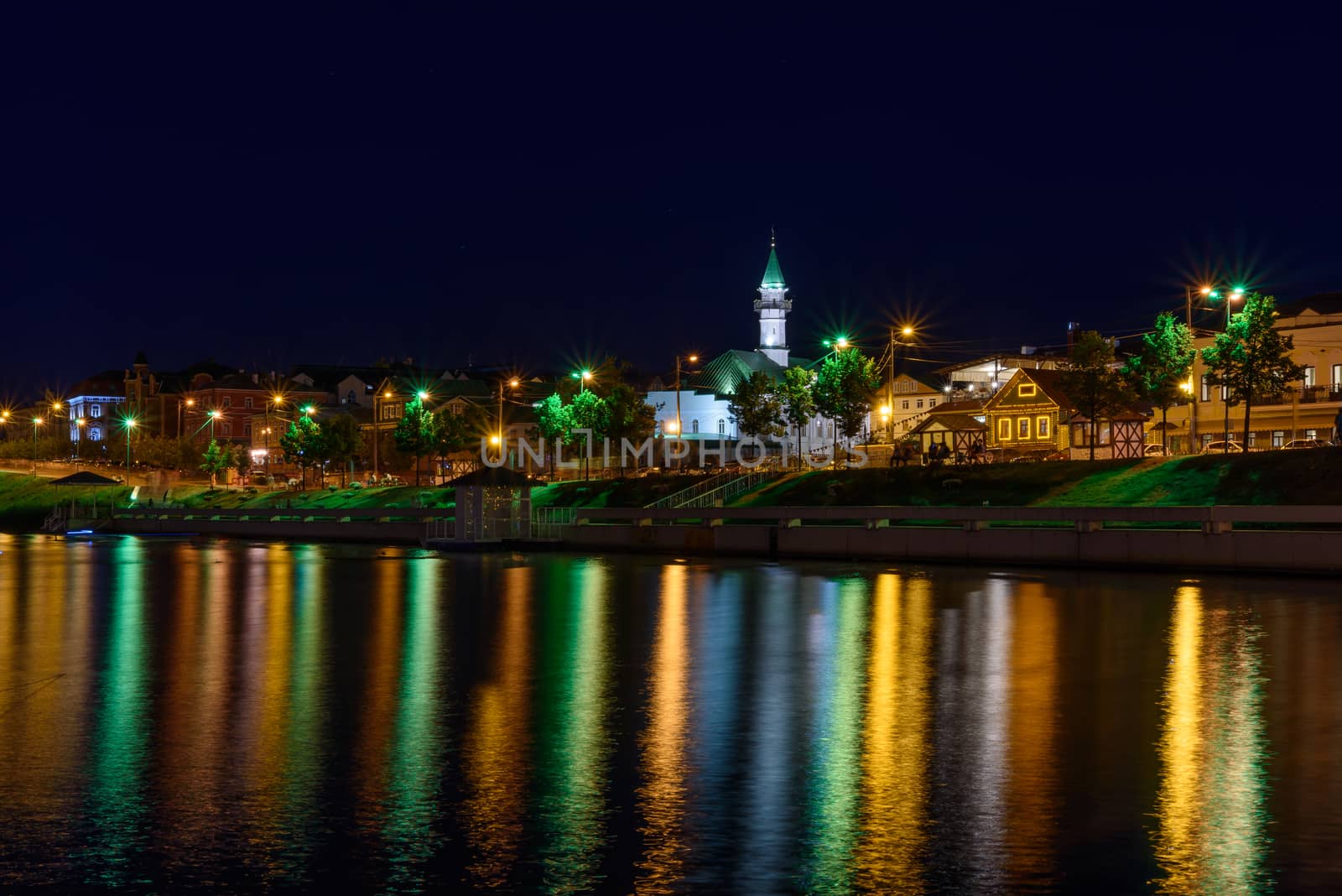 The city of Kazan during a beautiful summer night with colorful lights.. View of the waterfront of Kaban Lake.