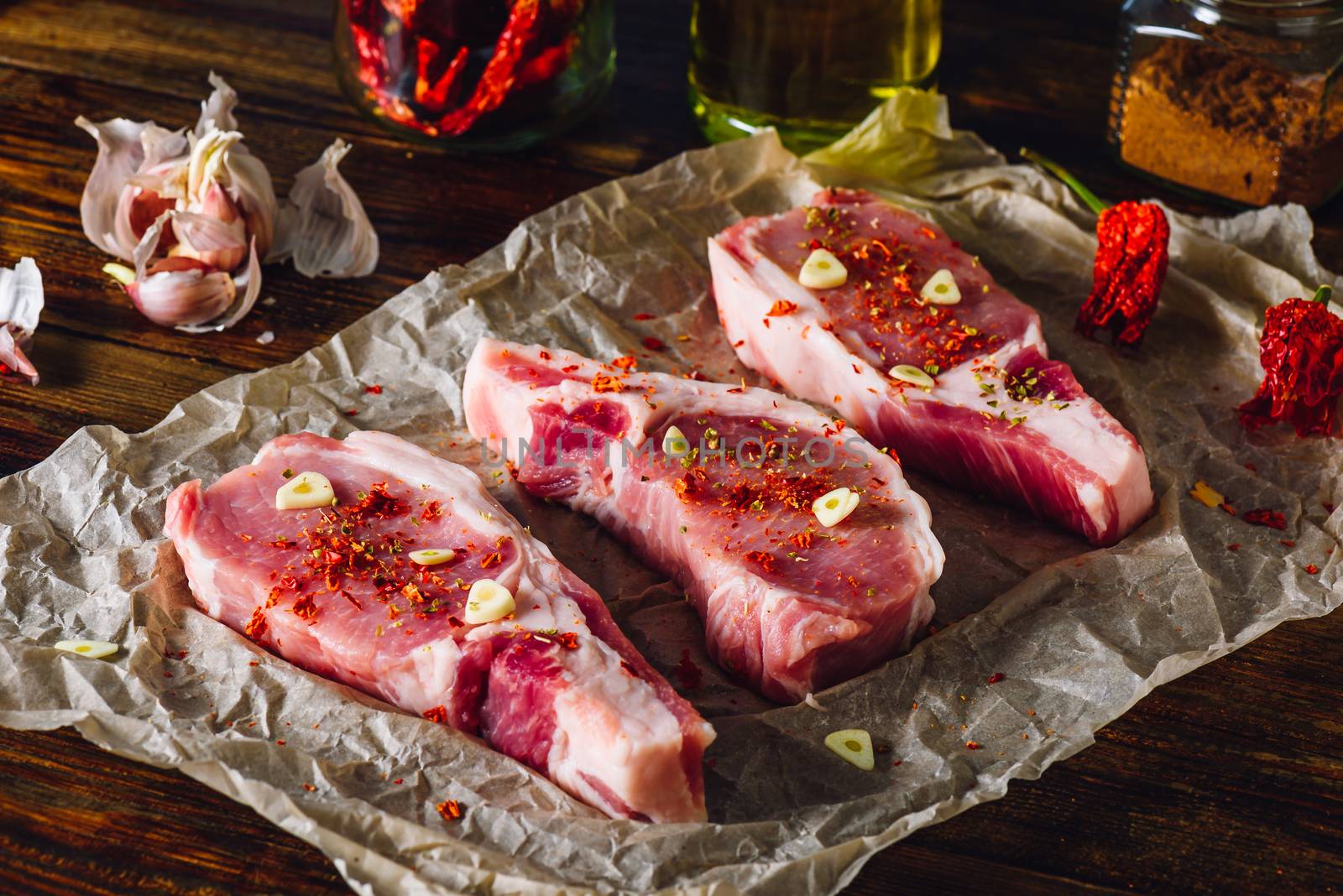 Pork Loin Steaks Prepared with Spices, Chili Pepper and Garlic.