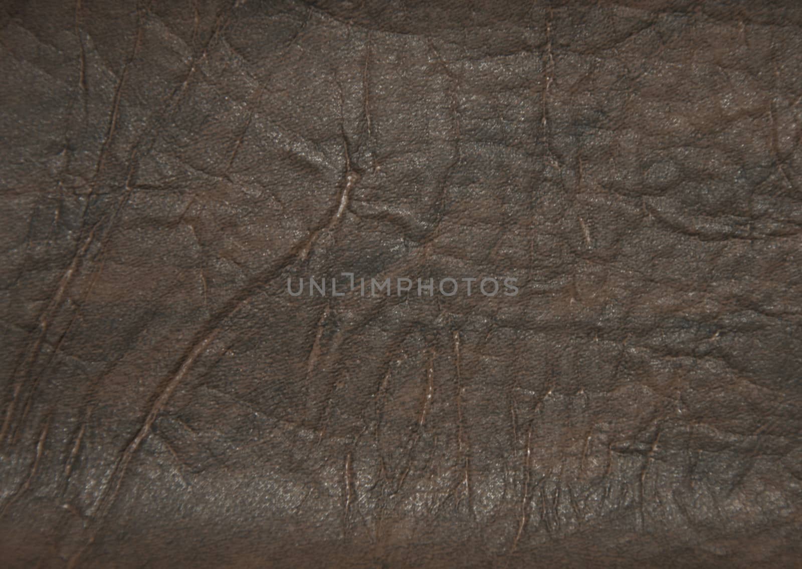 Decorative surface imitating artificially made leather. The picture was taken in the daytime, closeup.