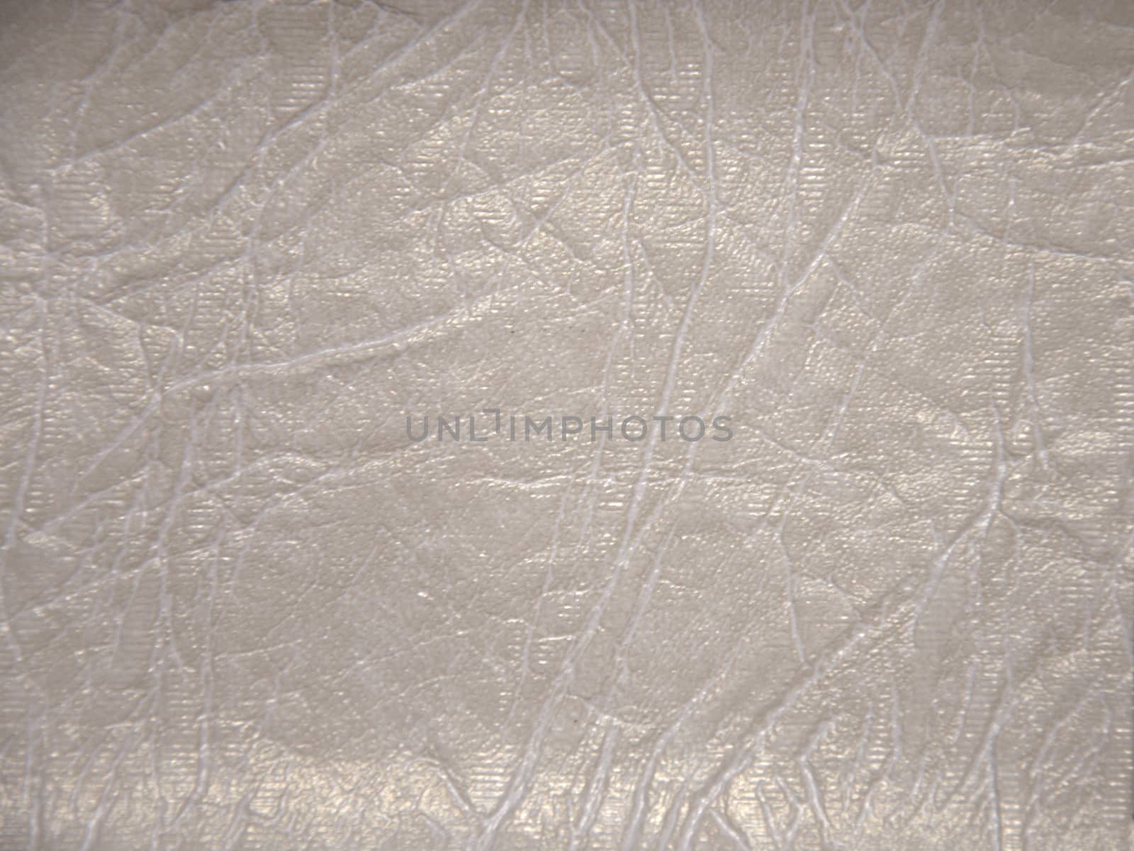 Decorative surface imitating artificially made leather. The picture was taken in the daytime, closeup.