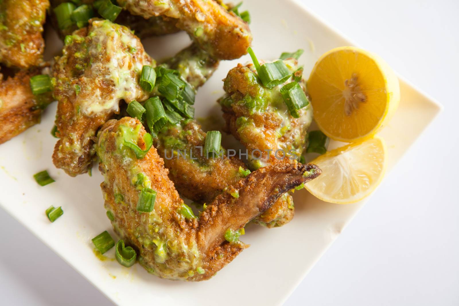 Green Chilli Chicken Wings Close Up by haiderazim