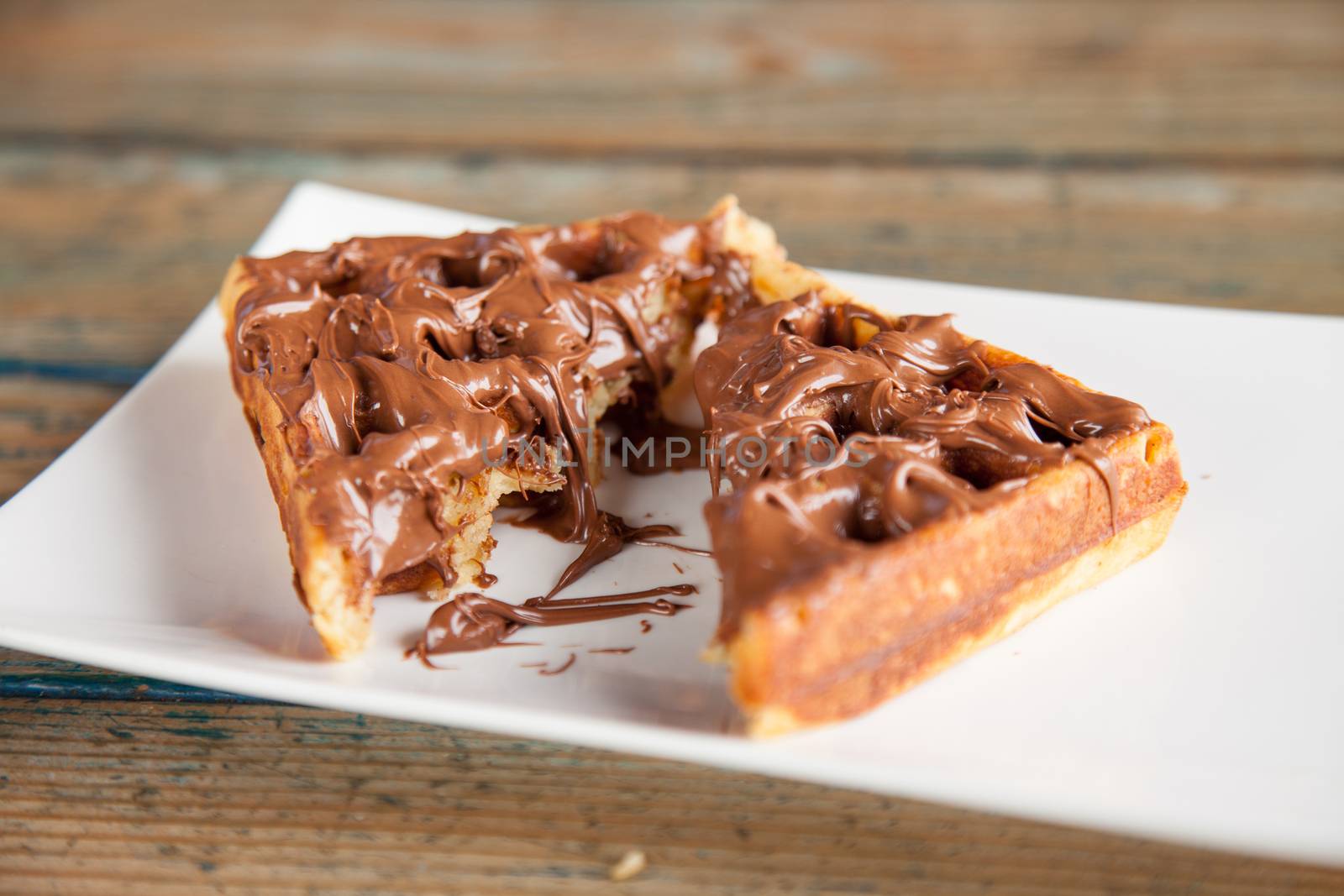 Nutella waffle pancake chocolate snack cut in to half by haiderazim