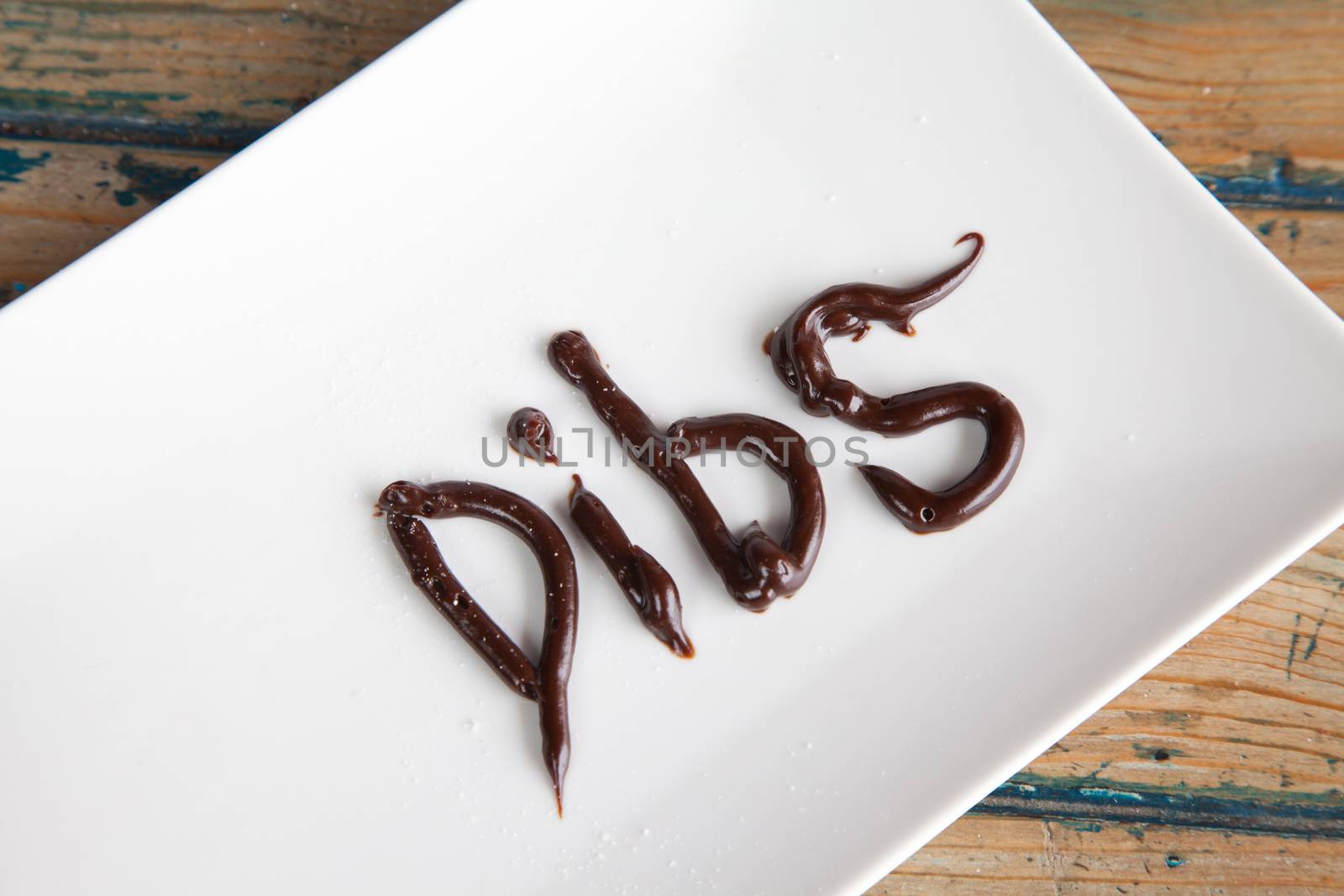 Dibs written on plate with chocolate fudge