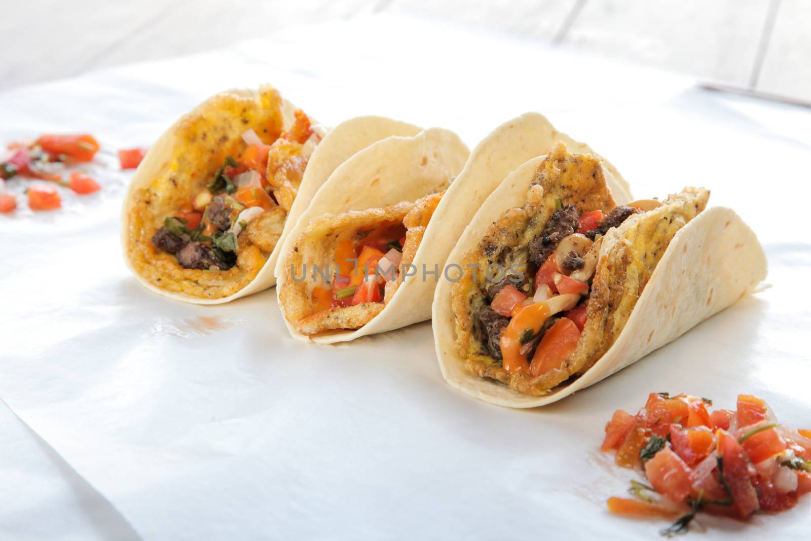 Breakfast tacos with egg omelette cheese mushroom and meat by haiderazim