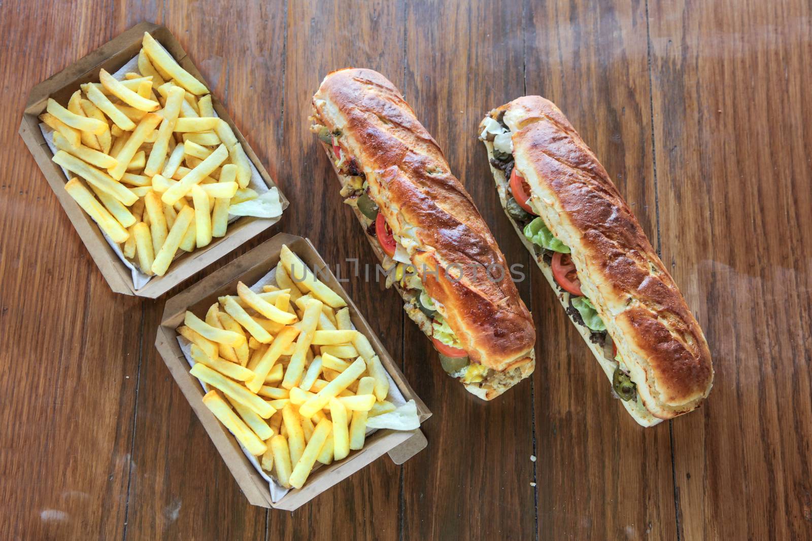 Extra large mighty sandwiches with box of potato french fries me by haiderazim