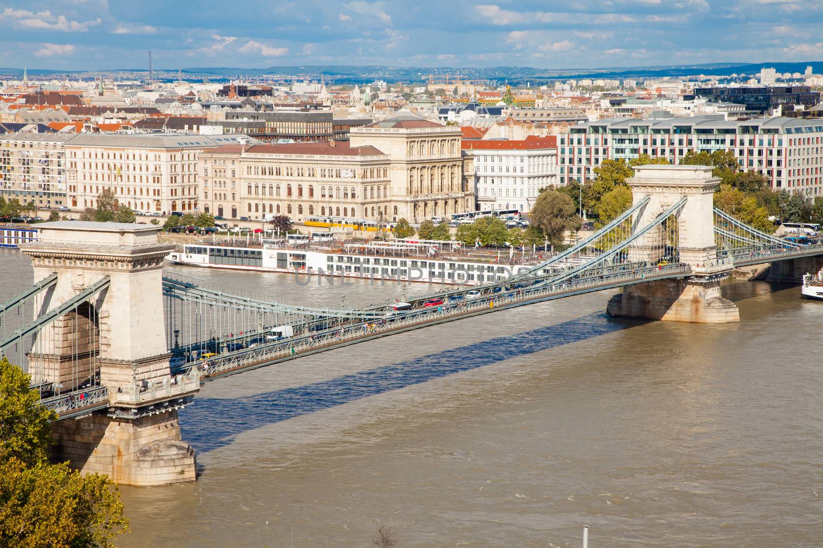 Széchenyi Chain Bridge is a suspension bridge that spans the river Danube between Buda and Pest