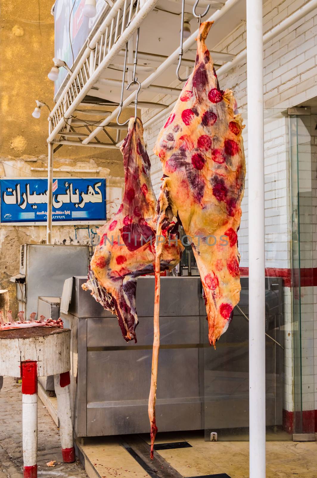 EGYPT, HURGHADA - 04 Avril 2019:Beef district hanged in the open air in front of a butcher's shop in Egypt