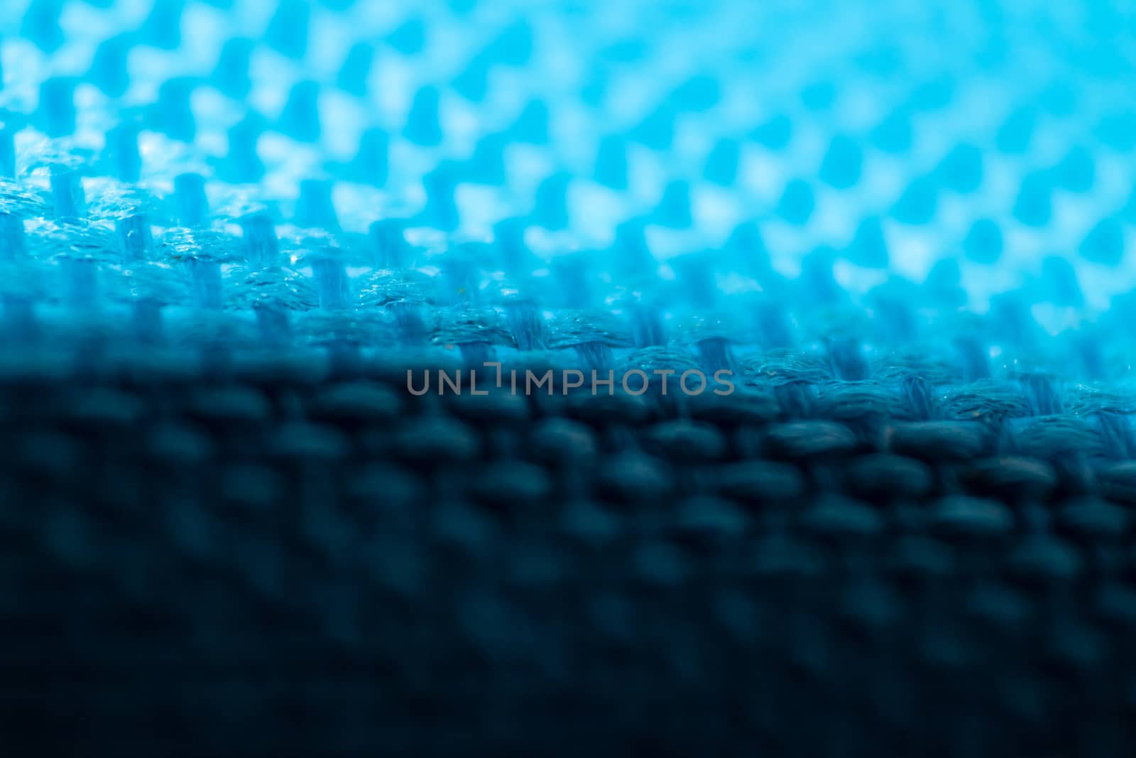 an interesting macro shoot of swollen braided blue cloth texture. bottom side of picture got shadow.