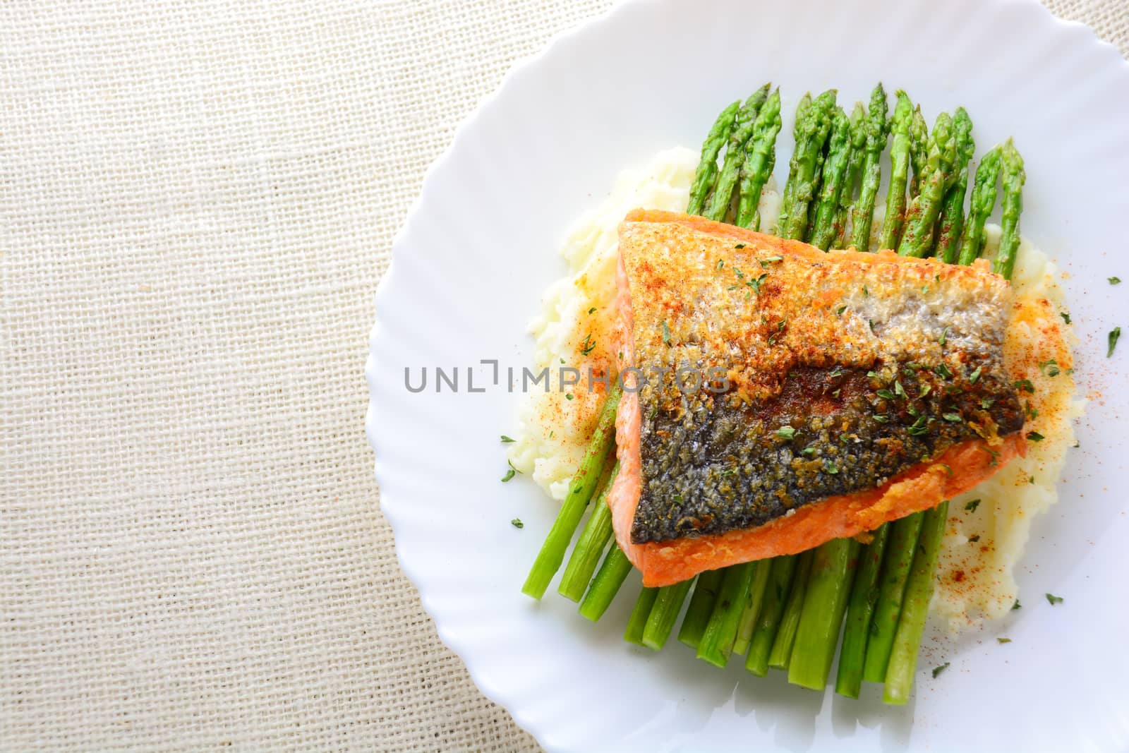 Grilled salmon garnished with asparagus and herbs by yuiyuize