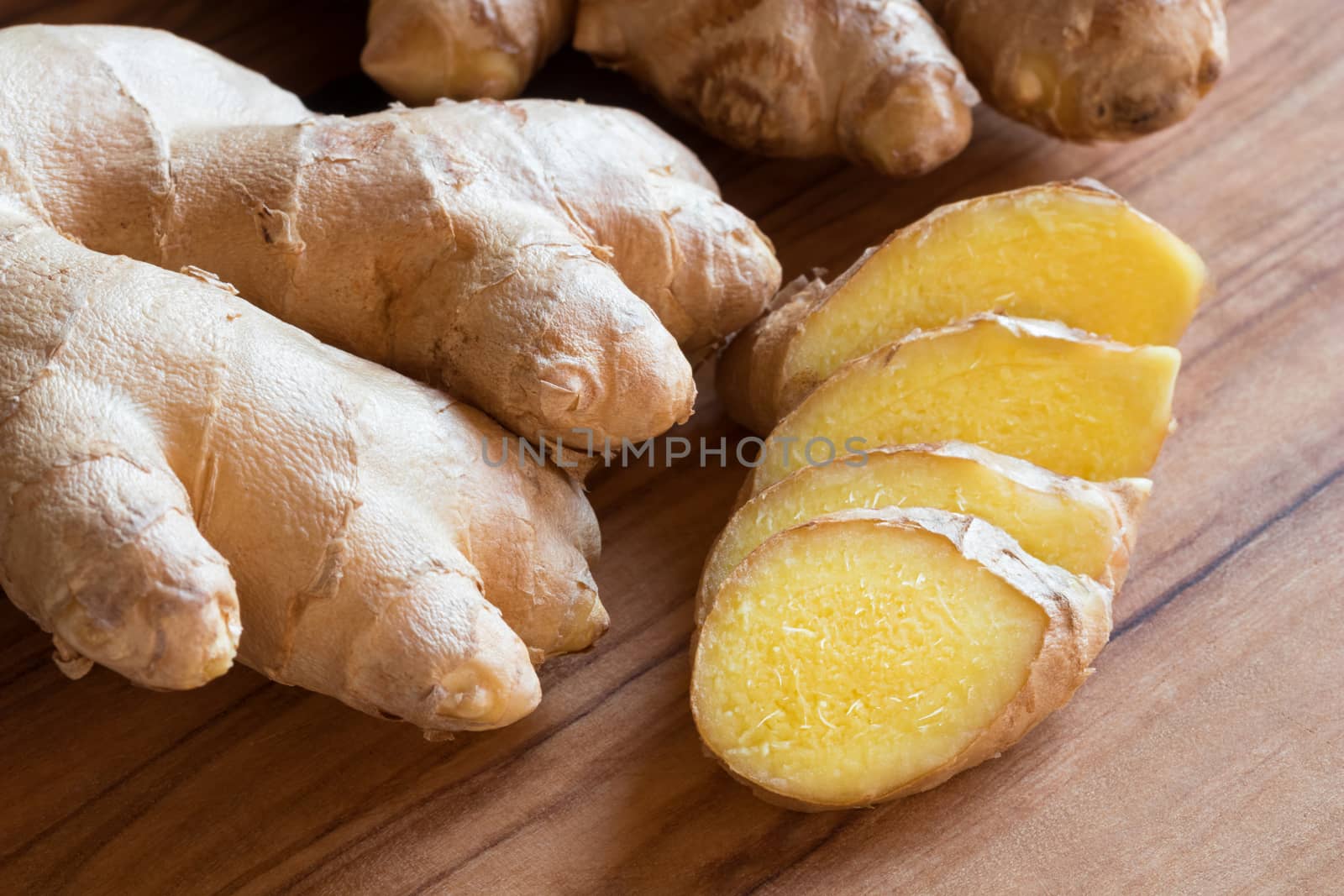 Fresh ginger root on a wooden table