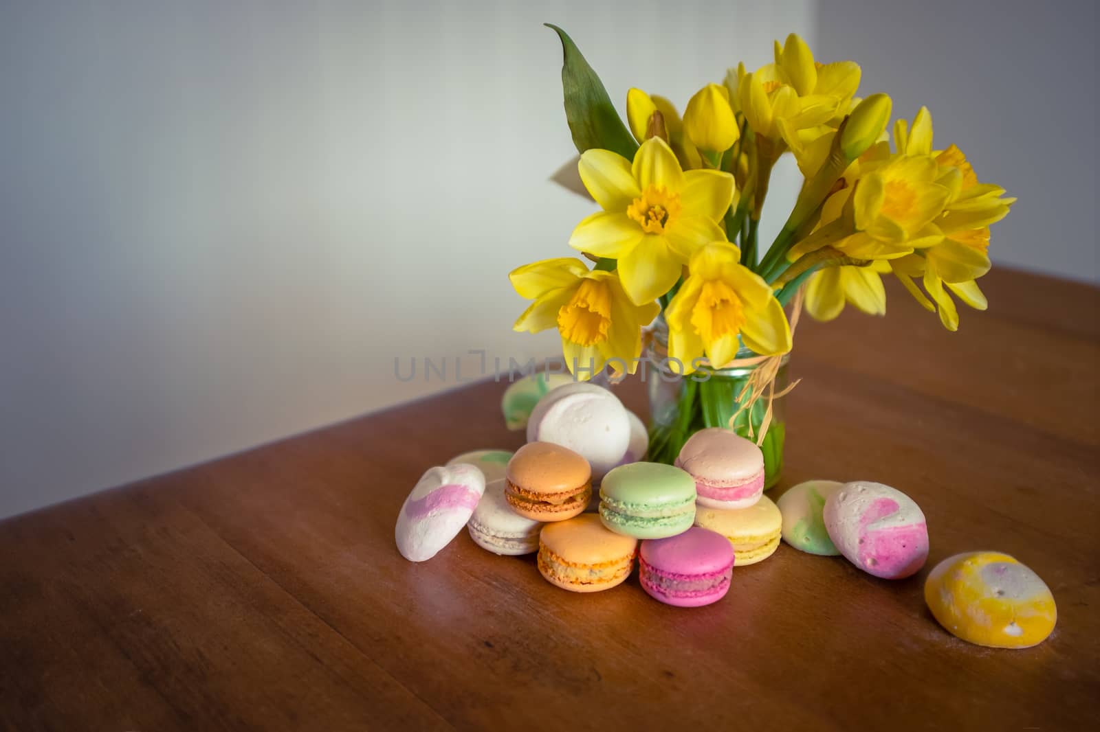 Flowers And Macarons On A Rustic Old Country Kitchen Table With Copy Space