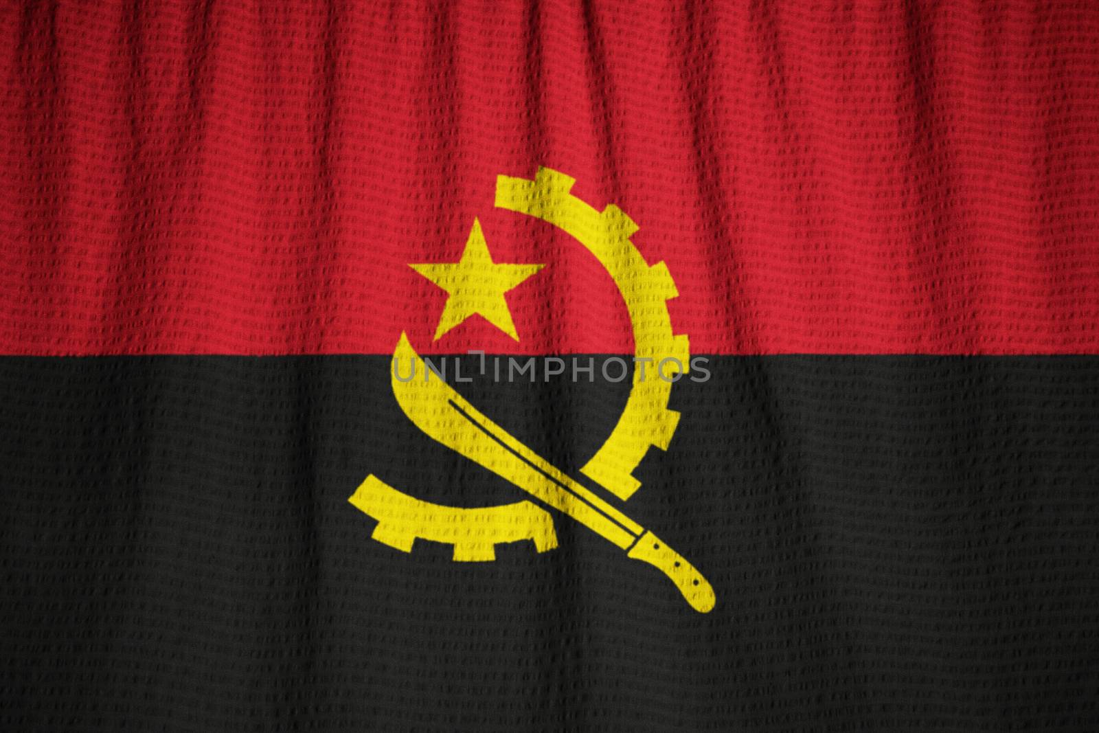 Ruffled Flag of Angola Blowing in Wind