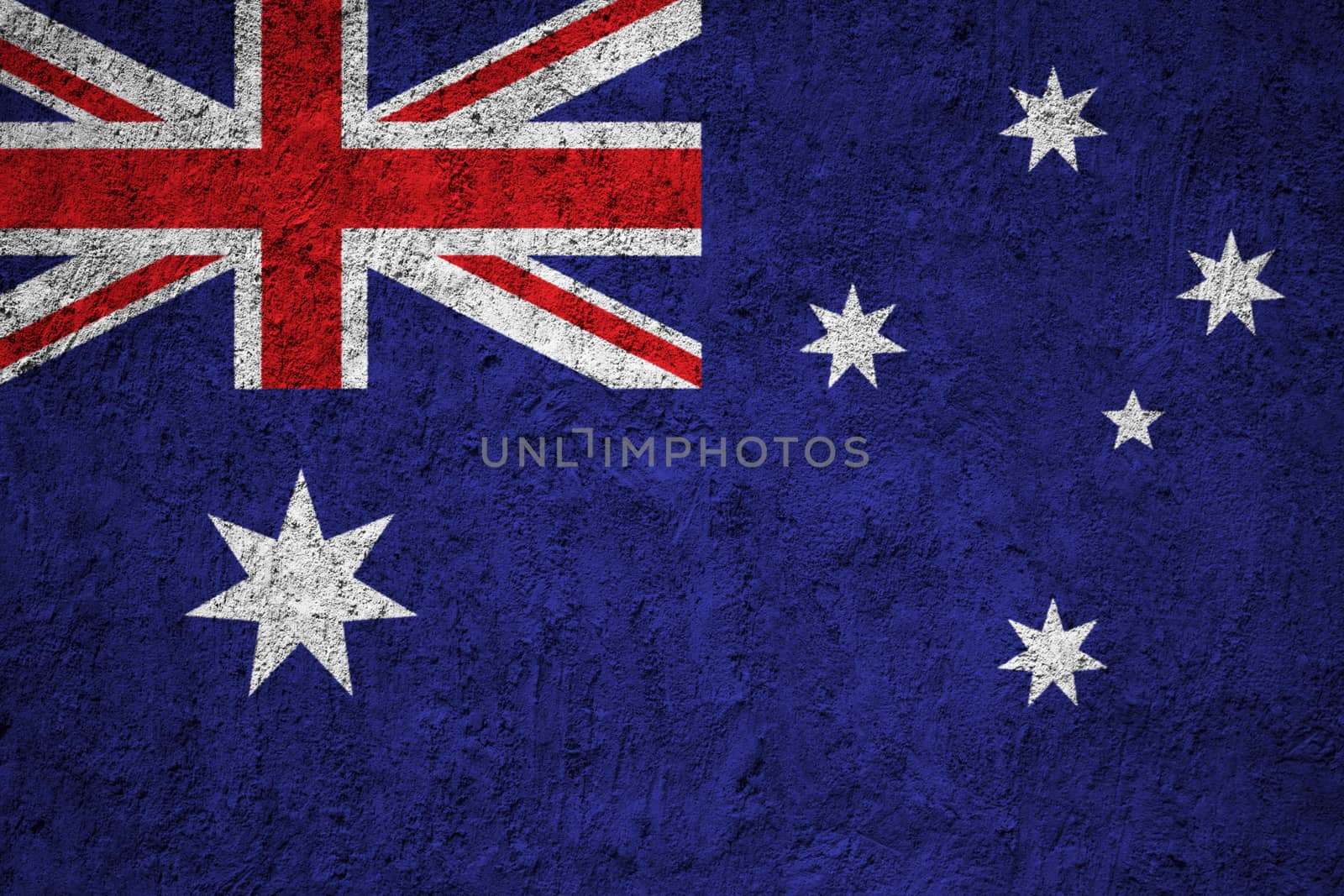 Australia flag painted on the cracked grunge concrete wall