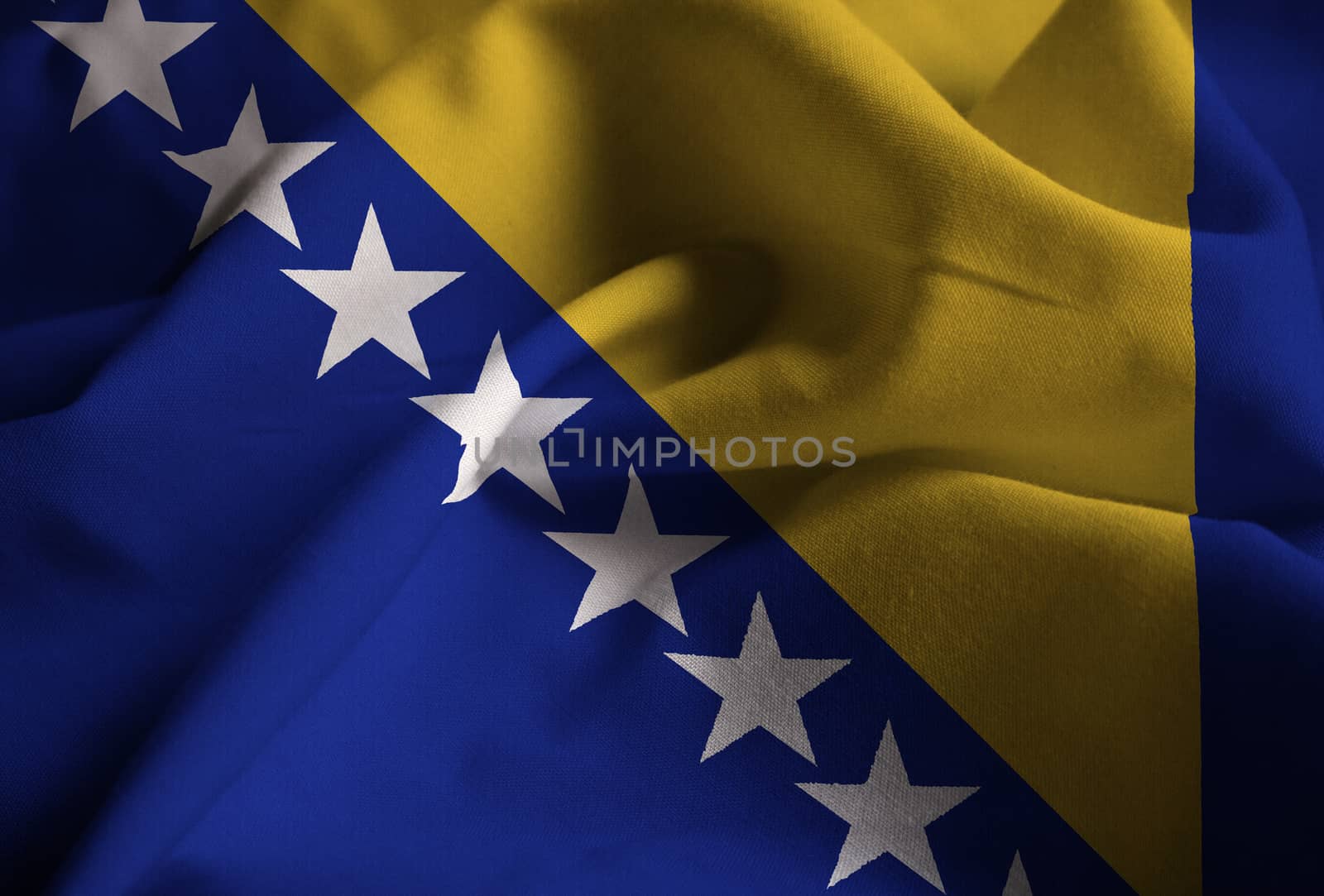 Ruffled Flag of Bosnia and Herzegovina Blowing in Wind