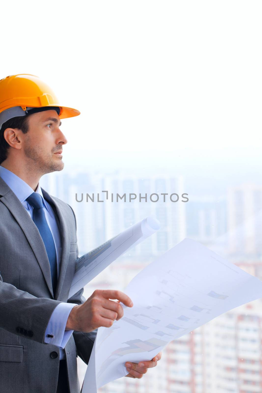 Architect in hardhat with blueprint by ALotOfPeople