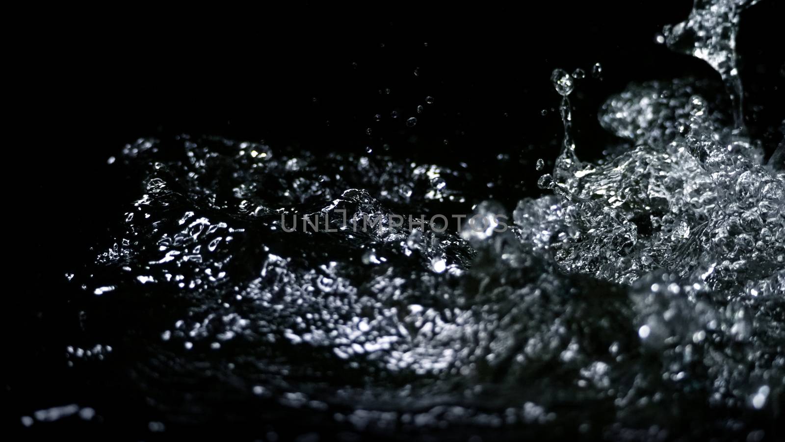 Blurry images of drinking water liquid wave or carbonate drink or oil shape or soda splashing and floating drop in black background for represent sparkling refreshment and refreshing