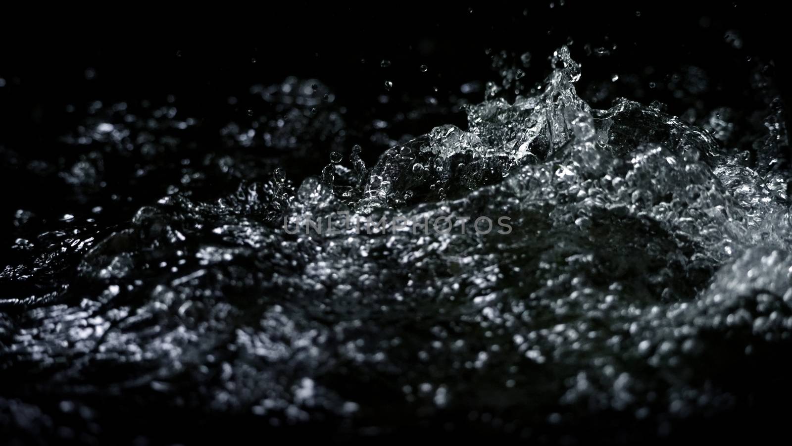 Blurry images of drinking water liquid wave or carbonate drink or oil shape or soda splashing and floating drop in black background for represent sparkling refreshment and refreshing