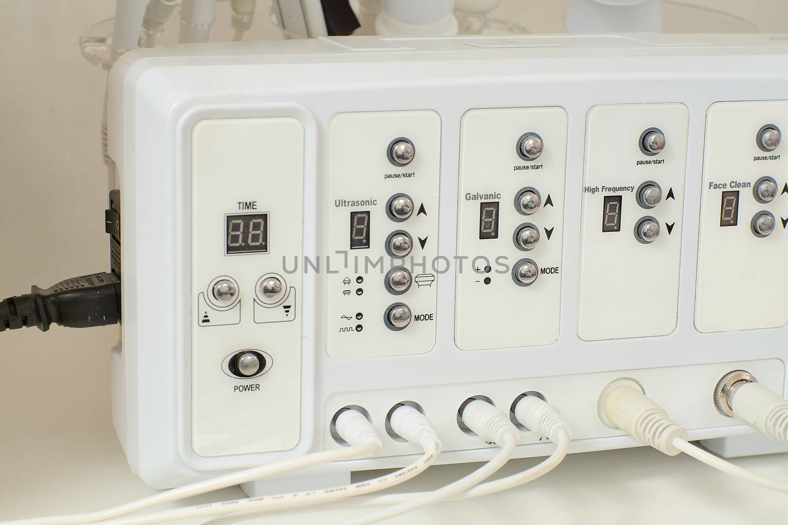 Cosmetic Multifunctional Device close-up in beauty salon. Ultrasound medical device. Darsonval device. Ultrasound procedure. Medical equipment healthcare. Young skin. Face professional massage.