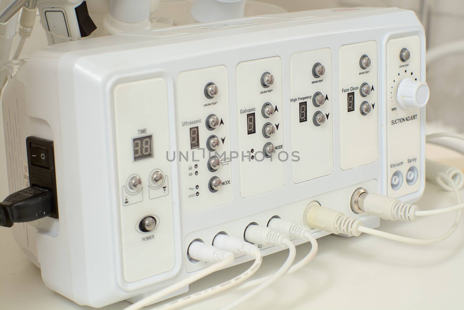 Cosmetic Multifunctional Device close-up in beauty salon. Ultrasound medical device. Darsonval device. Ultrasound procedure. Medical equipment healthcare. Young skin. Face professional massage.