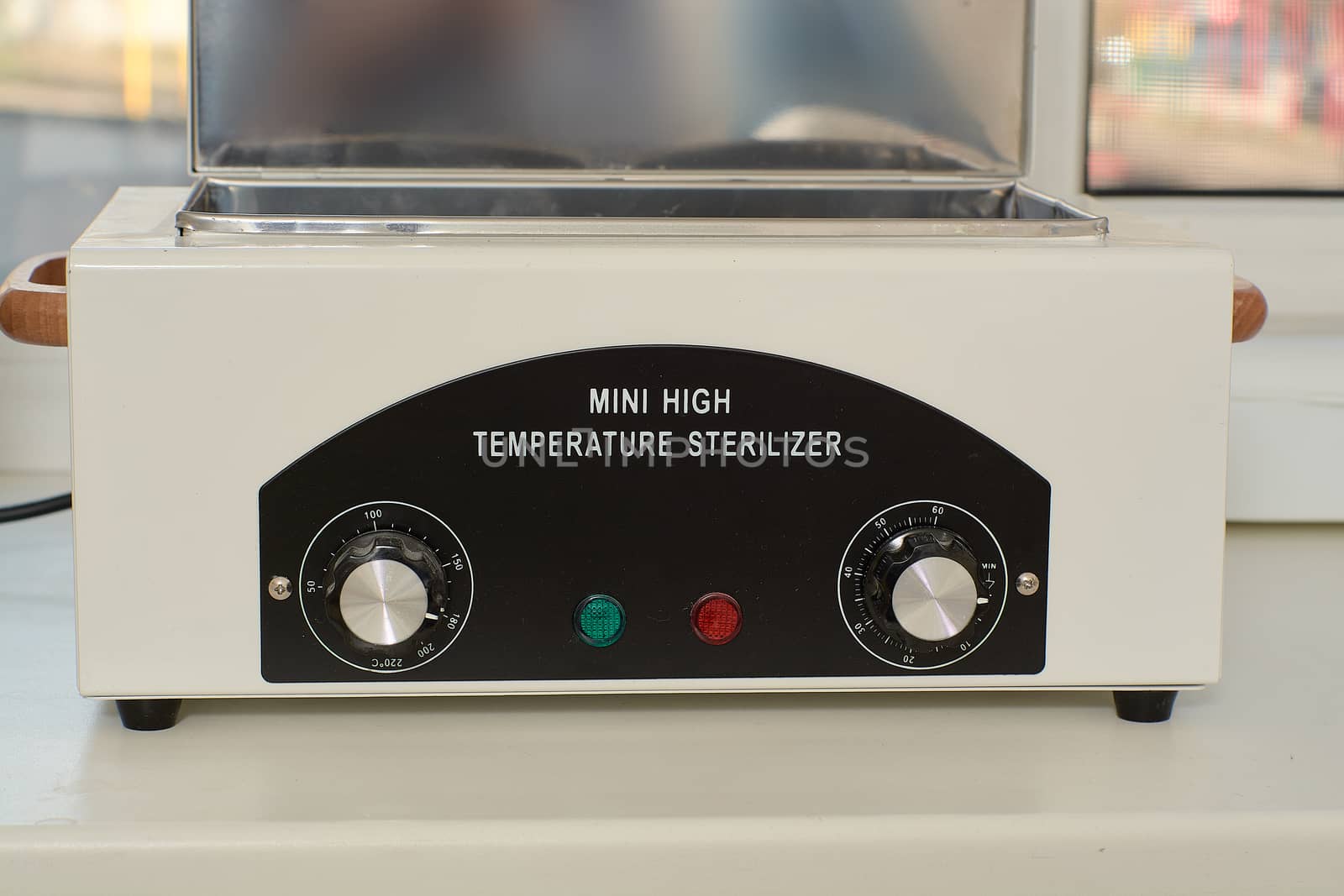 Mini high temperature sterelizer. Medical equipment healthcare. Modern medical technology concept. Modern hospital. Close-up sterilizer for manicure tools.