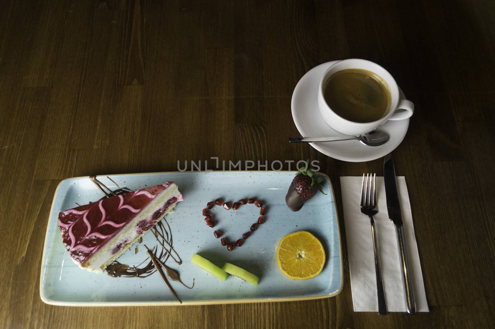 tray stands on sliced chocolate cake and drink by sonyugur