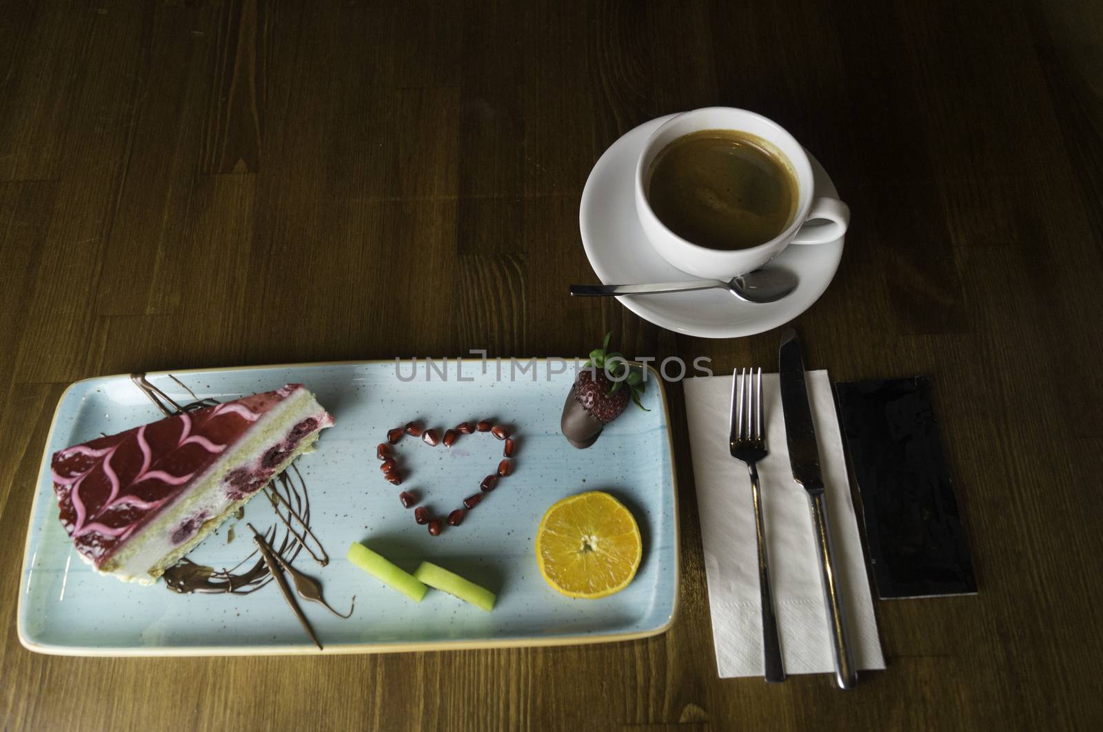 tray stands on sliced chocolate cake and drink by sonyugur