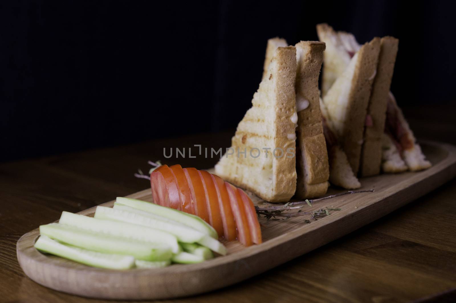 sliced cheddar and sausage toast cucumber tomato tea prepared for breakfast