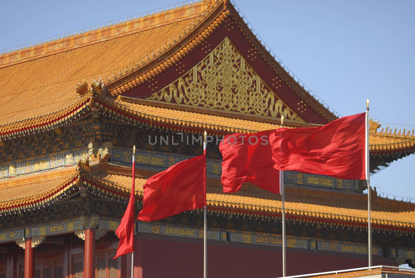 Chinese red flags on top of main gate pavilion to Forbidden City.