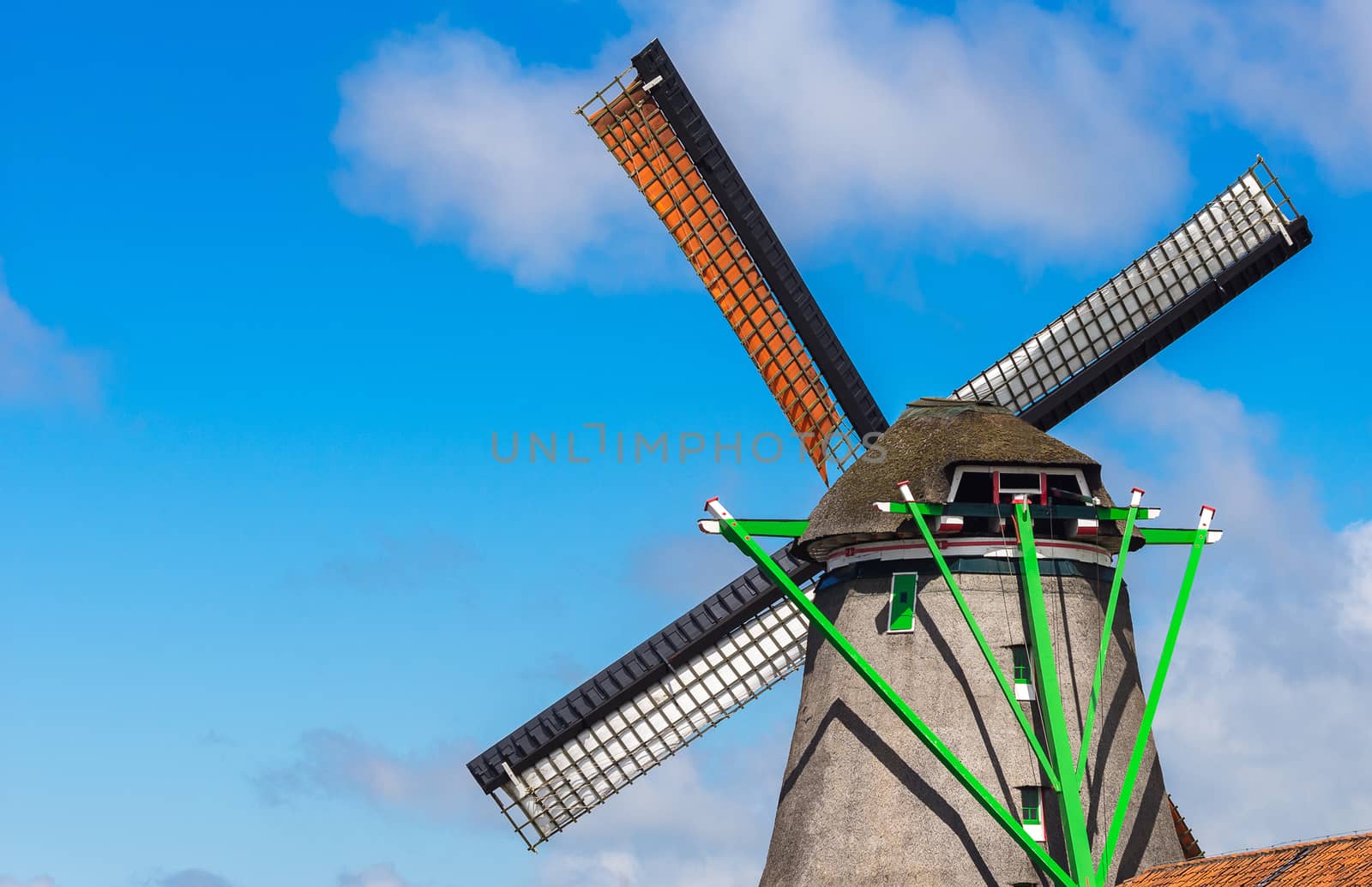 Windmill in agriculture farm with clear blue sky at Zaanse Schans, famous landmark near Amsterdam, Netherland, Europe