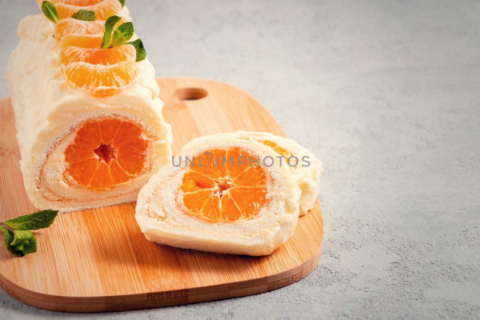 Sweet cake roll with whipped cream and tangerine filling by galsand