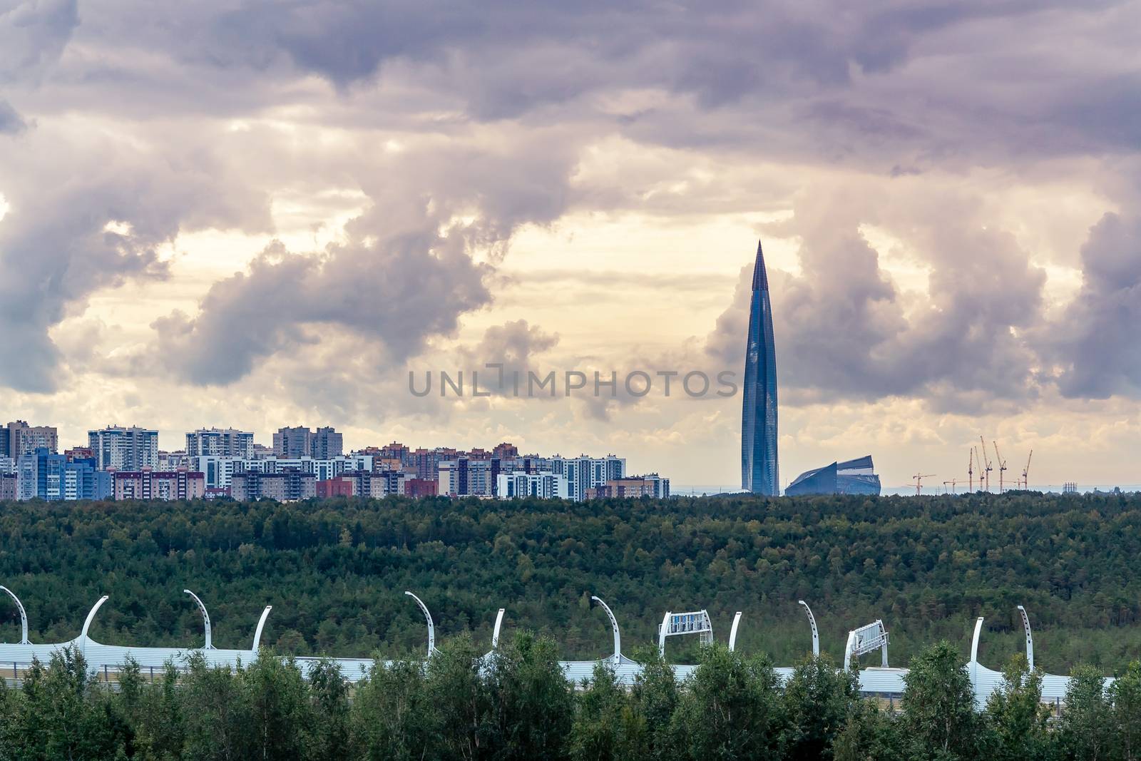 Evening cityscape. View of the Lakhta Center tower in St. Petersburg with dramatic clouds.