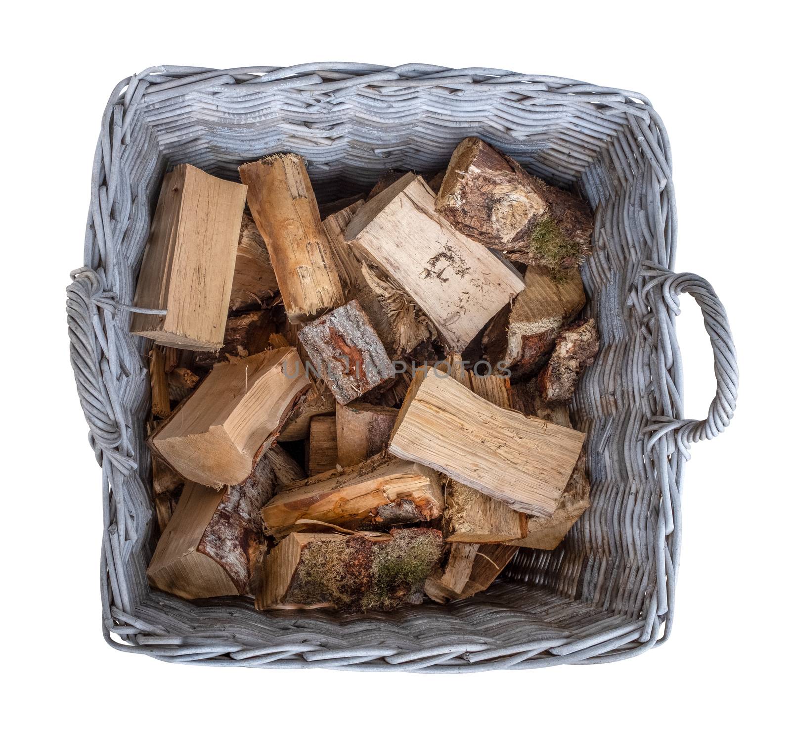 Isolated Old Basket of Cut Firewood In A Rustic Wicker Basket