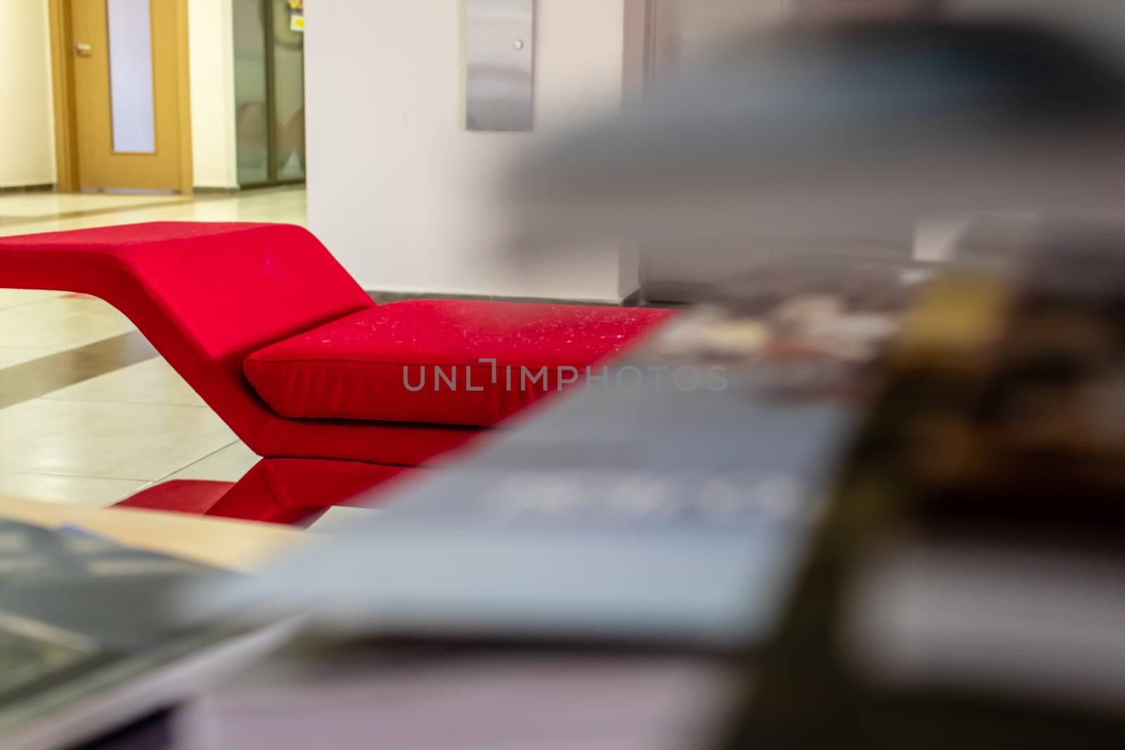 a closeup perspective shoot of a red sofa - focus on edge of sofa. photo has taken from an university at izmir/turkey.