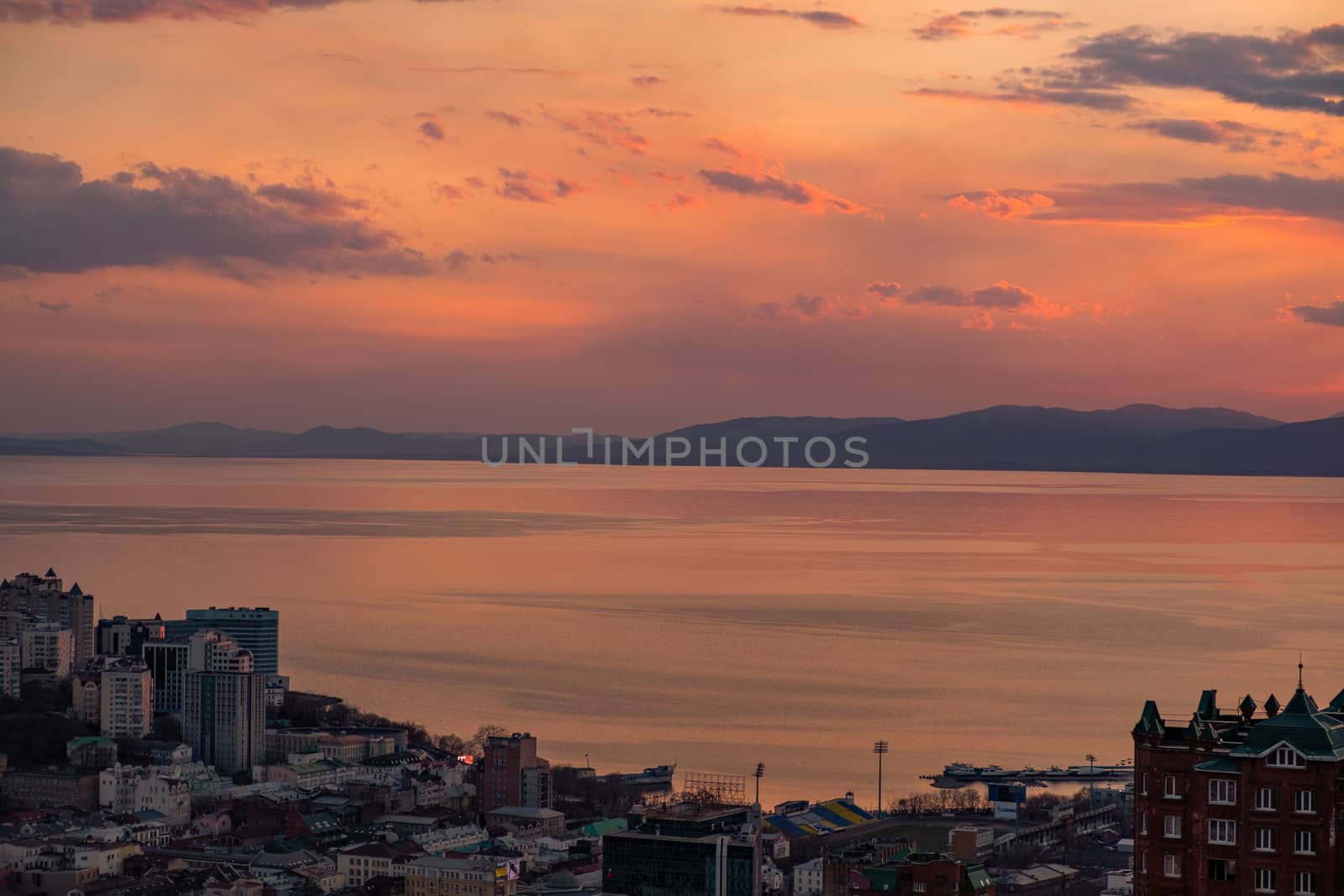 Panoramic view of the city of Vladivostok against the sunset. by rdv27