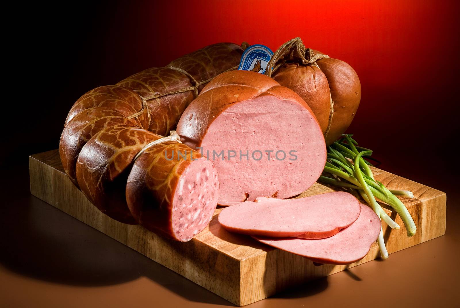 Still life with meat and different accessories on a studio background