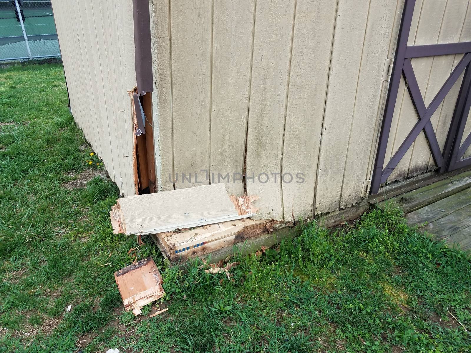 broken wood storage shed or building or structure with damage