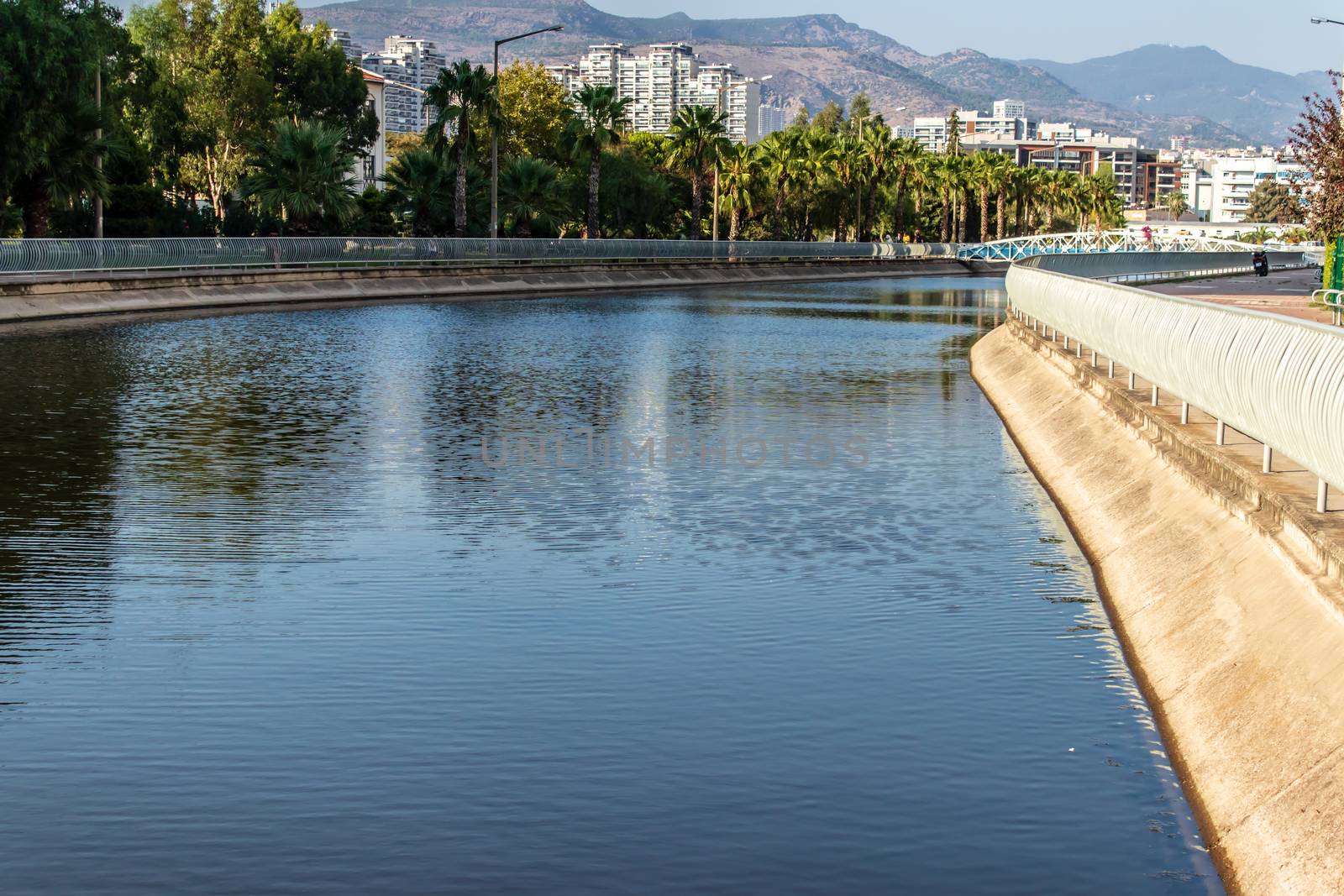 a landscape shoot from canal at mavisehir - there is trees and blue sky. photo has taken from izmir/turkey.