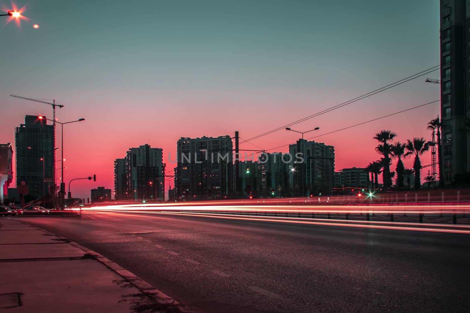 a long exposure cityscape shoot at sunset - red color is dominant. photo has taken at izmir/turkey.