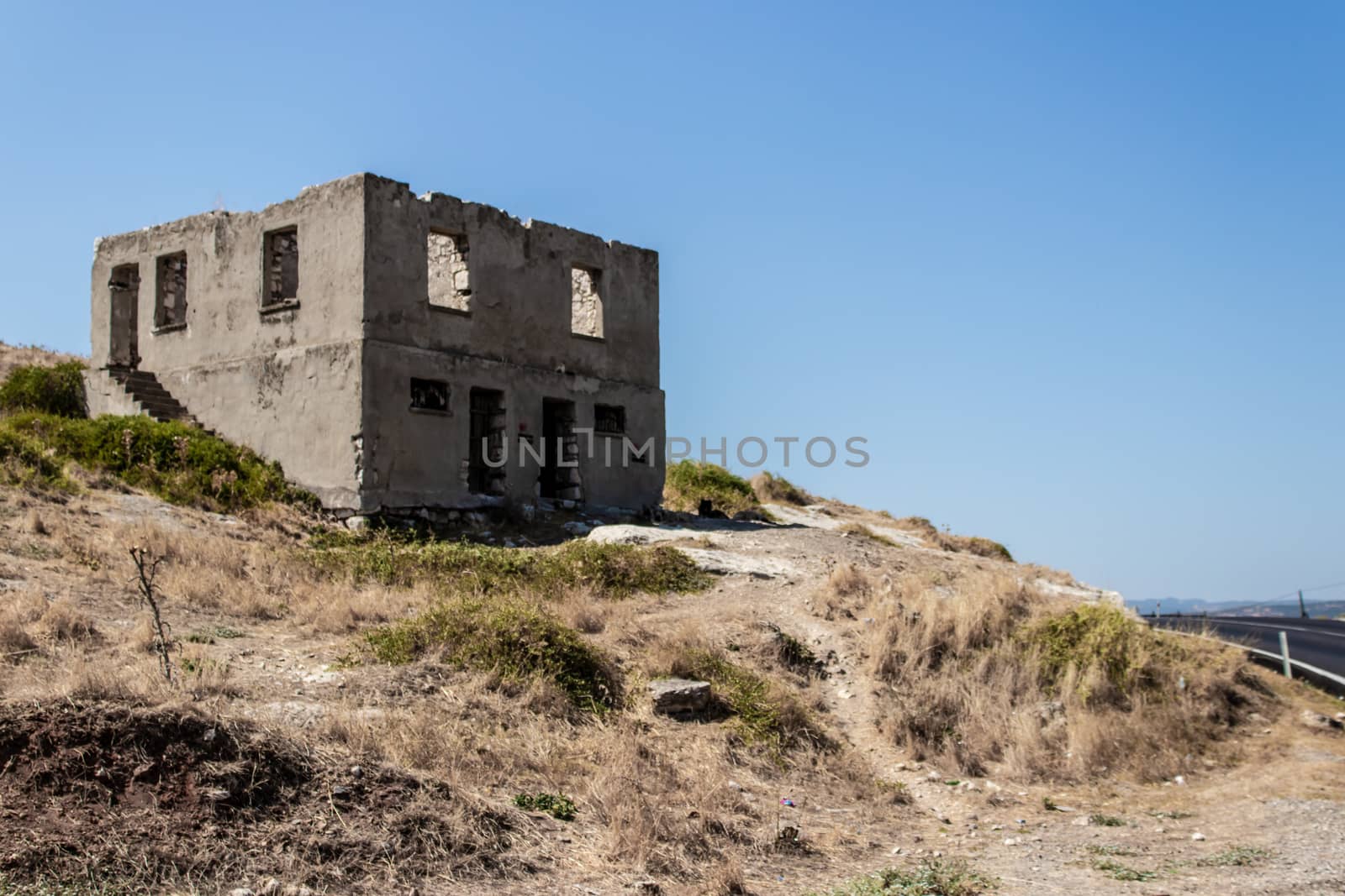 an antique stone building at a hill of mountain. photo has taken at a village at izmir/turkey.